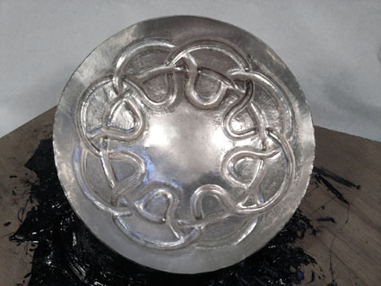3.	Bowl 1 - The design on this bowl is chased, so it is currently  set into pitch to allow me to work the silver more easily.